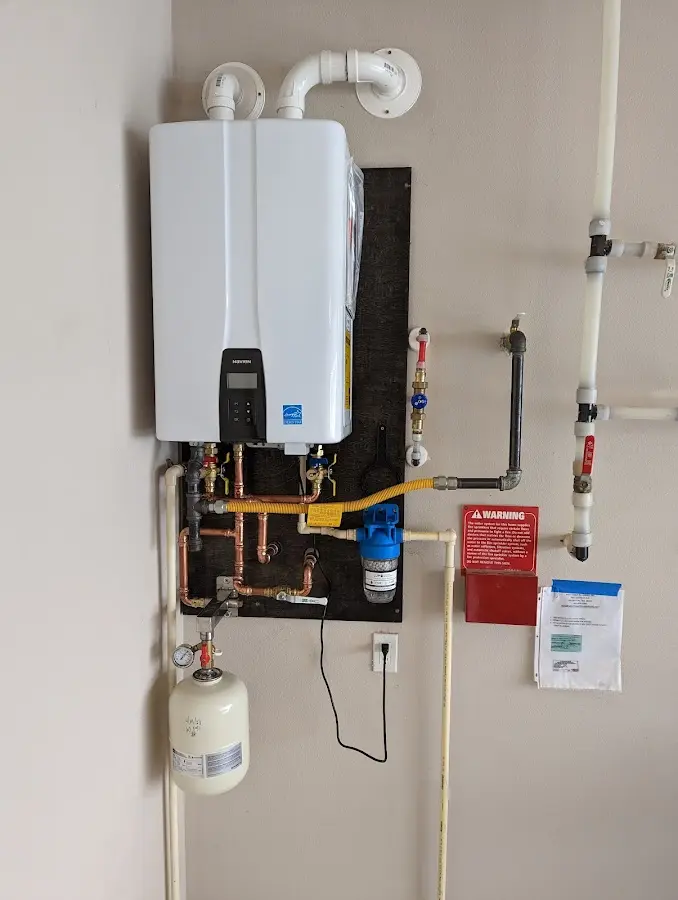 Professional plumber installing copper piping in a Ormond Beach home